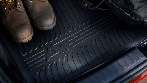 Adjustable lumbar support with massage feature for the front seats